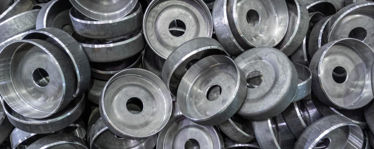 abstract heavy industry production full frame background stamped round workpieces